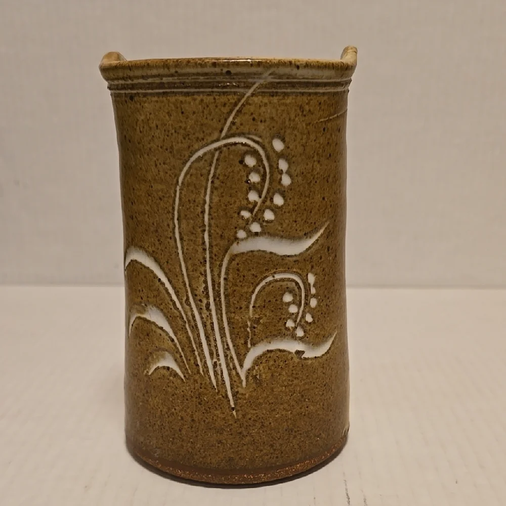 Brown Signed Pottery Vase with White Floral Design